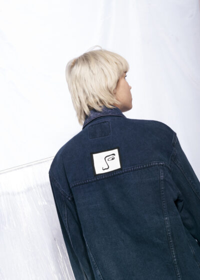 Reworked vintage overdyed denim jacket w weird face patch
