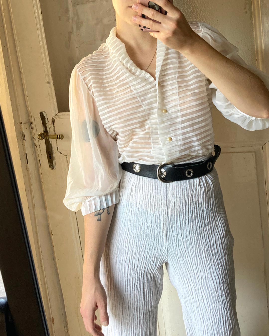 Selfie photo of a model wearing sheer vintage blouse